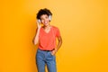 Photo of curly wavy trendy cheerful cute nice charming attractive black girlfriend wearing jeans denim t-shirt listening Royalty Free Stock Photo