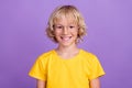 Photo of cute charming school boy wear yellow t-shirt glasses smiling isolated purple color background