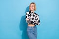 Photo of cute dreamy woman dressed cow print outfit arms crossed looking empty space isolated blue color background Royalty Free Stock Photo