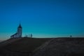 Photo of cute fantastic charming Saint Primoz church on a small hill with mountains in background at sunset, Jamnik village, Royalty Free Stock Photo