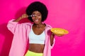 Photo of cute fooling dark skin woman dressed crop top smiling ready eat cornflakes spoon close eye isolated pink color Royalty Free Stock Photo