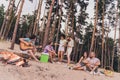 Photo of cute funky young people wear casual clothes sitting fire enjoying guitar songs outside countryside