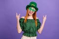 Photo of cute funky young woman dressed off-shoulders blouse headwear showing hard rock sign isolated violet color Royalty Free Stock Photo