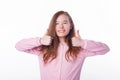 Photo of cute girl showing thumbs up over white background Royalty Free Stock Photo