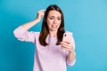 Photo of cute horrified troubled young woman hold telephone finger head city government want demolish house for building Royalty Free Stock Photo