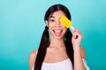 Photo of cute lovely funky lady hide eye with fruity frozen yogurt popsicle tongue out isolated cyan color background Royalty Free Stock Photo