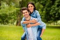 Photo of cute pair having fun together walking summer green park outdoors wear denim outfit Royalty Free Stock Photo