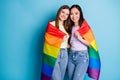 Photo of cute pretty lesbians couple ladies celebrate parade show tolerance same sex marriages hugging hold gay rainbow