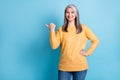 Photo of cute pretty retired woman hands hips direct finger empty space perfect proposition unique sale discount wear Royalty Free Stock Photo