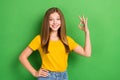 Photo of cute smiling teenager girl brown hair enjoy showing okey sign everything alright homework education done