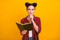 Photo of cute student lady two buns read story favorite novel look up empty space dreamer think over essay writing wear