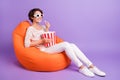 Photo of cute sweet woman wear knitted shirt sitting beanbag popcorn watching comedy movie violet color