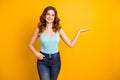 Photo of cute wavy curly cheerful fascinating pretty sweet girlfriend wearing turquoise tank-top jeans denim holding