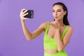 Photo of cute young woman taking selfie photo on smartphone Royalty Free Stock Photo