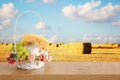 Photo of dairy products over wooden table. Symbols of jewish holiday - Shavuot