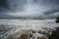 Photo of dark clouds over Sunshine Coast with foamy and rocky shore in Queensland, Australia Royalty Free Stock Photo