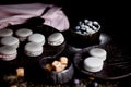 The photo in the dark gray scheme.Grey cake macaron. Macro. Blueberries, which strewed powdered sugar. Royalty Free Stock Photo