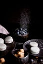 The photo in the dark gray scheme.Grey cake macaron. Macro. Blueberries, which strewed powdered sugar. Royalty Free Stock Photo