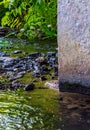 Photo of dark water flow near concrete column Royalty Free Stock Photo