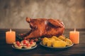 Photo of delicious tasty roast meat festive thanksgiving meal served with green garnish setting on wood table have corns Royalty Free Stock Photo