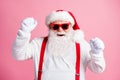 Photo delighted crazy santa claus raise fists enjoy rejoice x-mas christmas tradition discount lottery win wear style