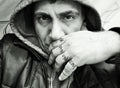 photo depicting a man with sweatshirt and hood.