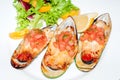 Close-up image grilled clam mussel and cheese with salad and lemon