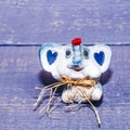 Small ceramic baby elephant on a wooden background