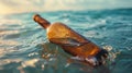 Lonely Message in a Bottle Adrift in the Ocean Waves Royalty Free Stock Photo