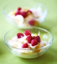 A photo of dessert - raspberries, banana and cream. A photo of dessert - raspberries, banana and cream.