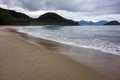 Detail of sand and waves foam on the beach of Felix in Ubatuba, Sao Paulo, Brazil