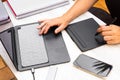 Photo detail of a woman working with a laptop and graphics tablet. Concept of study and work at home Royalty Free Stock Photo