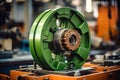 Photo of a detailed shot of a vibrant green thread spool on a textile machine. Modern metal processing at an industrial enterprise