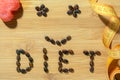 Diet word made of seeds and tape measure on wooden board Royalty Free Stock Photo