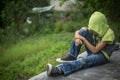 Photo dirty homeless boy with torn jeans