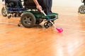 Disabled People on an electric wheelchair playing sports, powerchair hockey. IWAS - International wheelchair and amputee