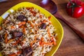 Photo of dish of uzbek pilaf made of rice and carrots, meat and onions Royalty Free Stock Photo