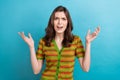 Photo of dissatisfied negative offended girl bad mood unhappy stressed annoyed wear striped t-shirt isolated on blue