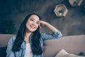 Photo of domestic pretty charming asian lady relaxing sit comfy couch staying home good mood leaning head on hand