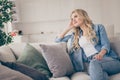 Photo of domestic pretty charming blond lady relaxing sit comfy couch staying home good mood lean head on hand dreamer