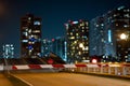 Photo of a drawbridge going up with city landscape buildings in background