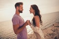 Photo of dream couple lovers hold hands sunset time honeymoon wear casual outfit nature seaside beach outdoors Royalty Free Stock Photo