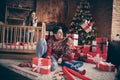 Photo of dream family prepare noel presents girl throw catch box wear sweater in decorated x-mas home indoors