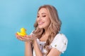 Photo of dreamy adorable lady wear white blouse holding arms small rubber duck isolated blue color background