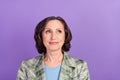 Photo dreamy calm old charming woman look empty space vintage clothes isolated on purple violet color background