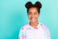 Photo of dreamy cheerful small trendy stylish young african american girl look empty space isolated on teal color Royalty Free Stock Photo