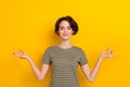 Photo of dreamy funny lady wear striped t-shirt smiling practicing yoga isolated yellow color background