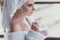 photo of dreamy lady after bath wash hair now drink aromatic coffee planning day at cozy home bath Royalty Free Stock Photo