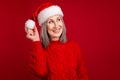 Photo of dreamy nice positive grandma hold pom pom look empty space wear hat knitted sweater isolated red color