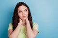 Photo of dreamy ponderous minded lady arms neck look empty space think ideas on blue background